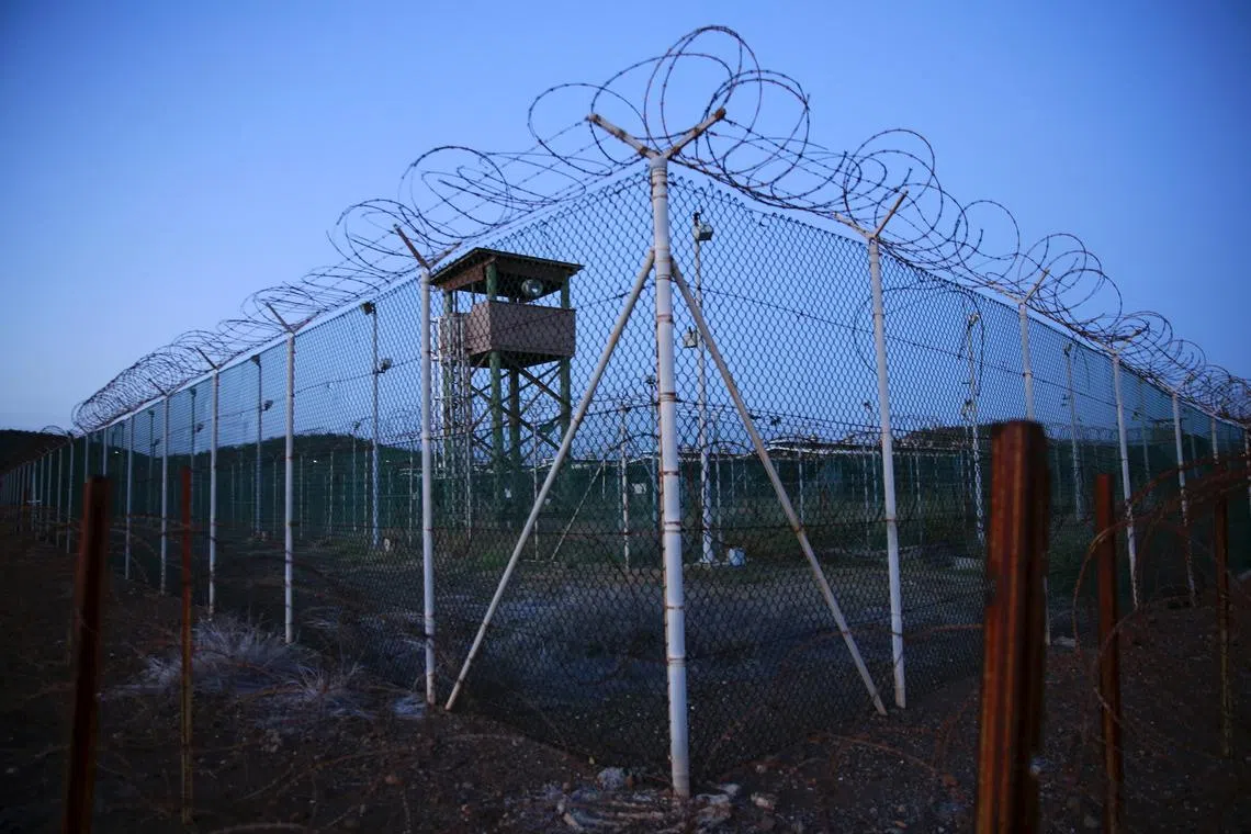 FILE PHOTO: Chain link fence and concertina wire surrounds a deserted guard tower within Joint Task Force Guantanamo's Camp Delta at the U.S. Naval Base in Guantanamo Bay, Cuba March 21, 2016.  REUTERS/Lucas Jackson/File Photo