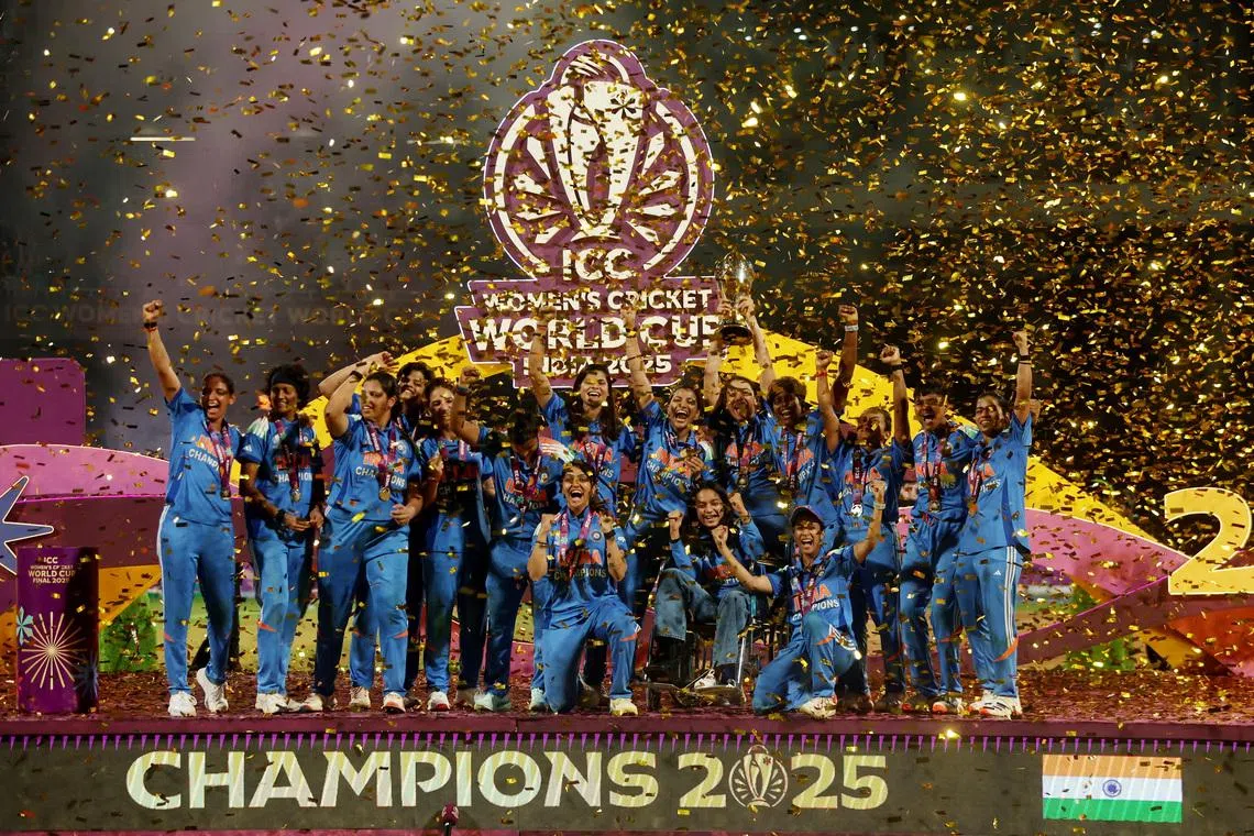 Cricket - ICC Women's World Cup - Final - India v South Africa - DY Patil Stadium, Navi Mumbai, India - November 2, 2025 India players celebrate with the trophy after winning the ICC Women's World Cup REUTERS/Francis Mascarenhas