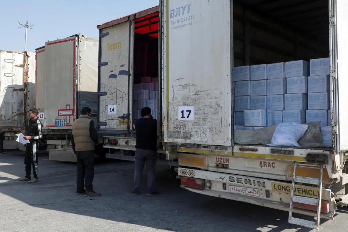 Trucks carrying aid from UN World Food Programme, following a deadly earthquake, at Bab al-Hawa crossing, Syria, on Feb 20, 2023.  