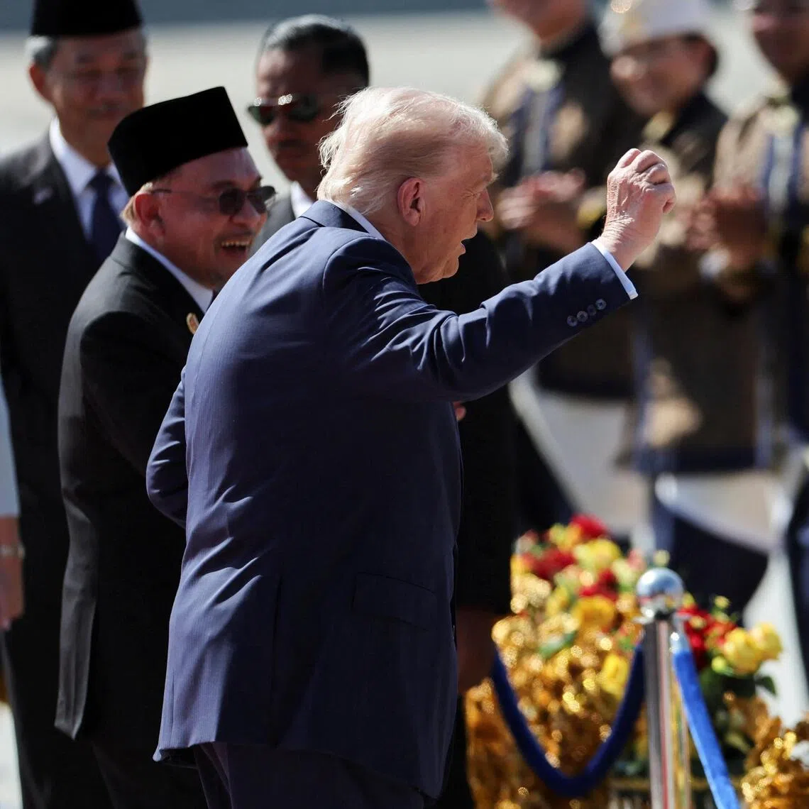 U.S. President Donald Trump joins the performers in a dance during a welcoming ceremony after arriving at Kuala Lumpur International Airport, to attend the 47th Association of Southeast Asian Nations (ASEAN) Summit, in Kuala Lumpur, Malaysia October 26, 2025. REUTERS/Hasnoor Hussain/Pool
