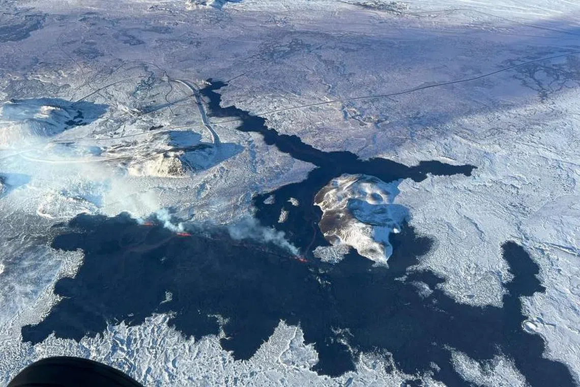 An arial view of a volcano spewing lava and smoke as it erupts, near Grindavik, on Reykjanes Peninsula, Iceland, February 8, 2024. Iceland Civil Protection/Handout via REUTERS