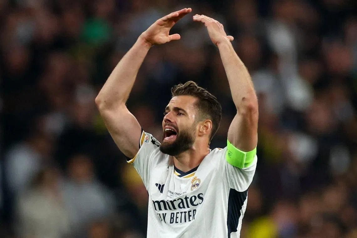 FILE PHOTO: Soccer Football - Champions League - Final - Borussia Dortmund v Real Madrid - Wembley Stadium, London, Britain - June 1, 2024 Real Madrid's Nacho celebrates their first goal scored by Dani Carvajal REUTERS/Lee Smith/File Photo