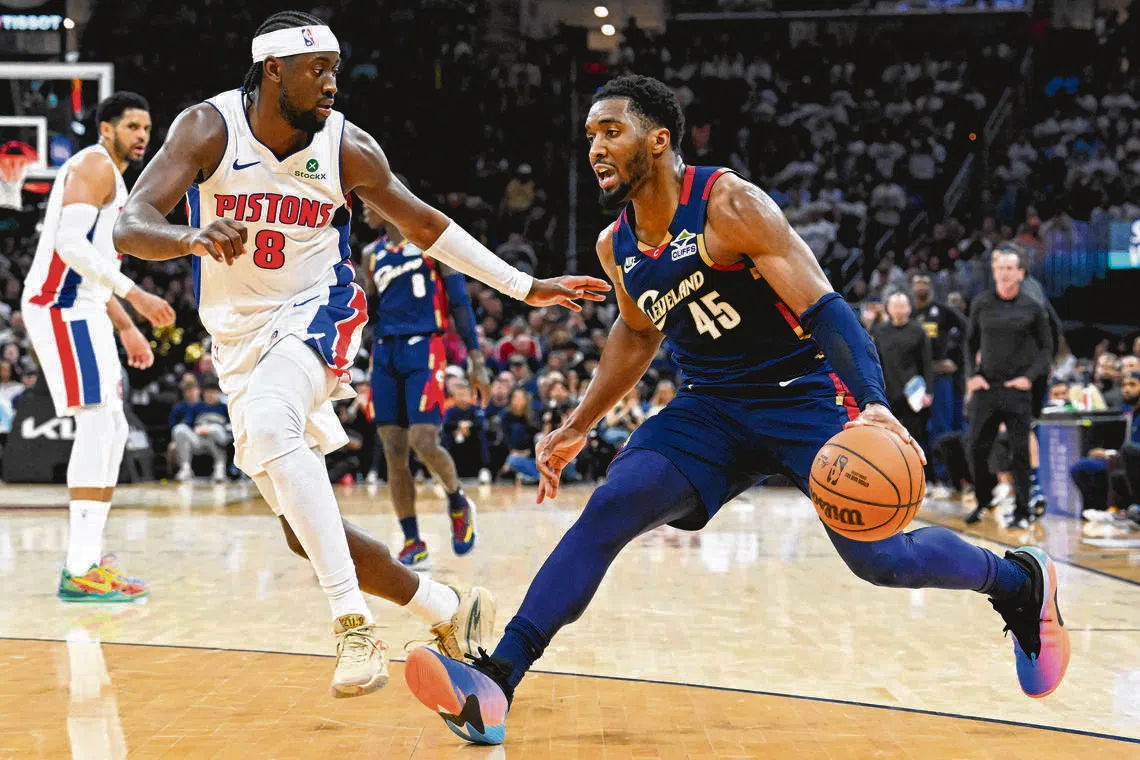 Donovan Mitchell of the Cleveland Cavaliers drives against Caris LeVert of the Detroit Pistons during the fourth quarter in Game 4.