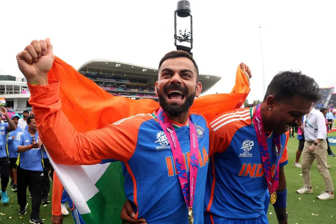 India's Virat Kohli (left) and Hardik Pandya celebrate after winning the T20 World Cup. 