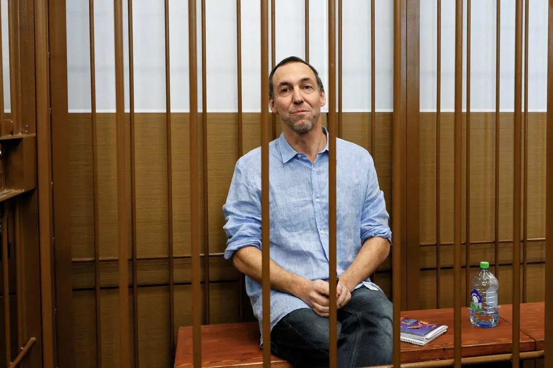 FILE PHOTO: French researcher Laurent Vinatier, who is suspected of illegally collecting sensitive Russian military information, sits inside an enclosure for defendants during a court hearing in Moscow, Russia July 31, 2024. REUTERS/Yulia Morozova/File Photo