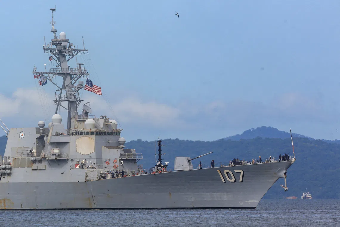 The U.S. Navy destroyer USS Gravely (DDG-107) approaches Port of Spain for joint training with the Trinidad and Tobago Defence Force to strengthen regional security and military cooperation, as seen from Port of Spain, Trinidad and Tobago, October 26, 2025. REUTERS/Andrea De Silva