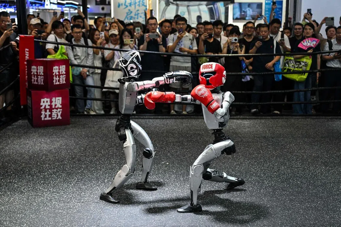 Humanoid robots controlled by a remote control by Unitree Robotics, one of three Chinese companies dominating the industry, on July 18.