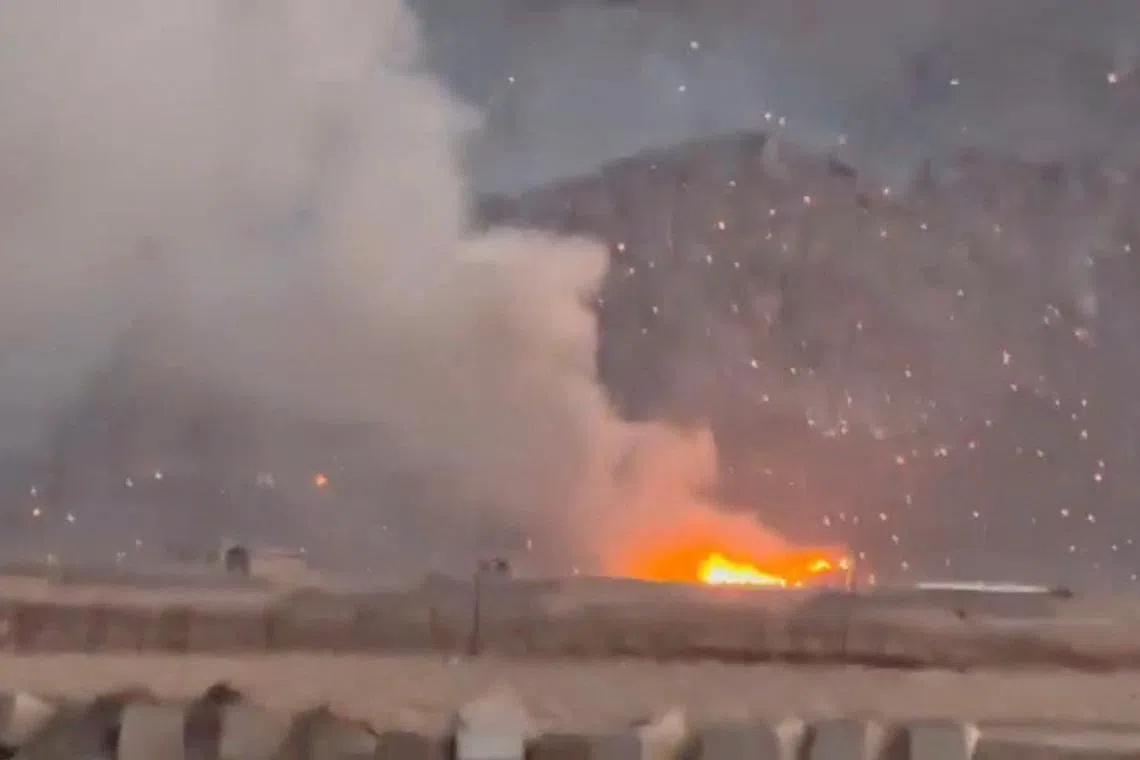 Smoke rises following a reported strike in Baharestan, Isfahan province in Iran, on April 1.