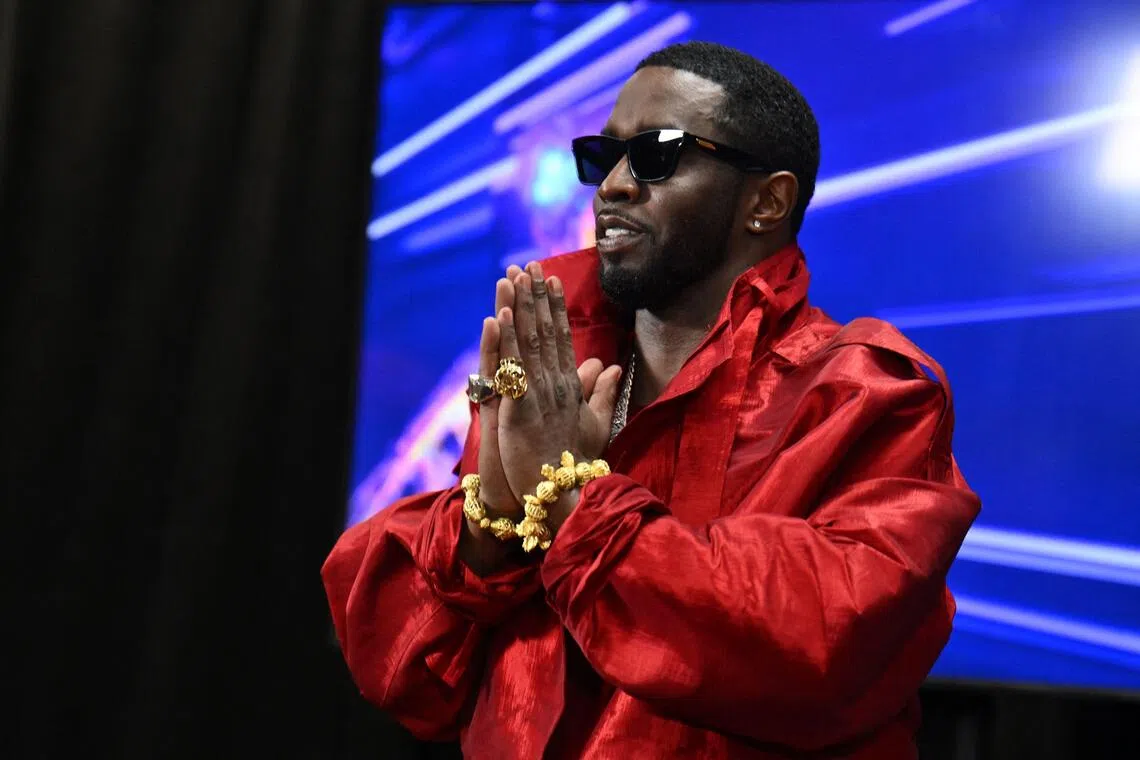 FILES) US producer-musician Sean "Diddy" Combs gestures in the press room during the MTV Video Music Awards at the Prudential Center in Newark, New Jersey, on September 12, 2023. Music mogul Sean "Diddy" Combs, who is to be sentenced in October for his conviction on prostitution-related charges, is seeking a pardon from President Donald Trump, one of his lawyers said August 5, 2025. "It's my understanding that we've reached out and had conversations in reference to a pardon," Nicole Westmoreland told CNN in an interview. Trump has indicated, however, that he is unlikely to grant a pardon to the 55-year-old Combs. (Photo by ANGELA WEISS / AFP)