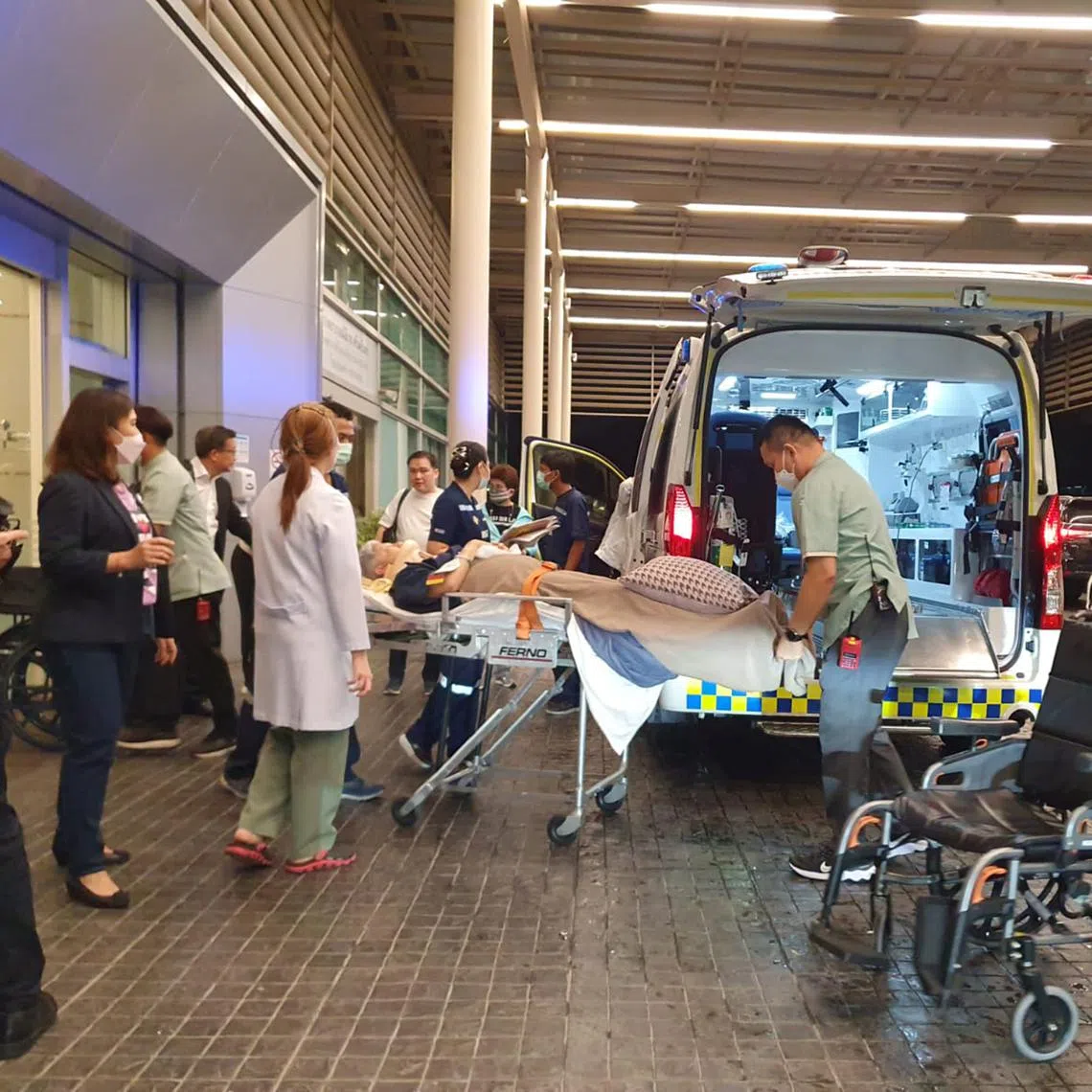 An injured SQ321 passenger being transferred from Samitivej Srinakarin Hospital in Bangkok to another hospital on May 21.