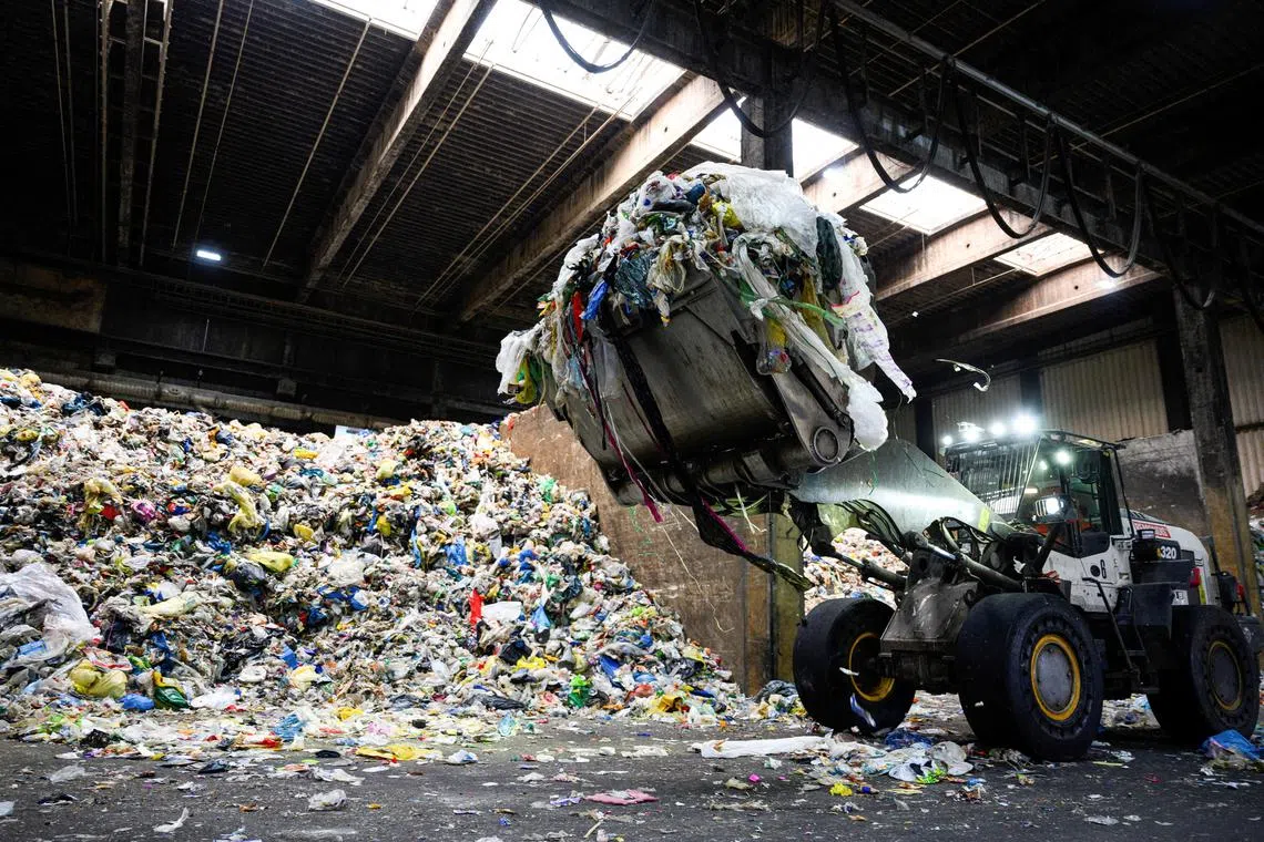Plastic trash waiting to be sorted at a German recycling firm. In the EU,27 per cent of plastic and 38 per cent of plastic packaging are recycled.