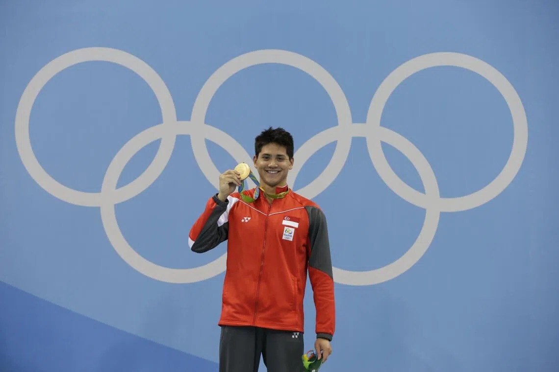 Joseph Schooling of Singapore with the gold medal on the podium after winning the 100m butterfly final in Rio de Janeiro on Aug 12, 2016.