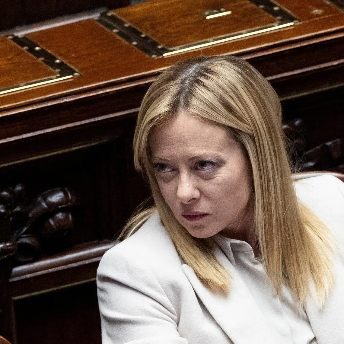 Italy's Prime Minister Giorgia Meloni looks on as she appears at the at the lower house of Parliament, ahead of a European Union leaders' summit, in Rome, Italy, December 17, 2025. REUTERS/Remo Casilli/File Photo
