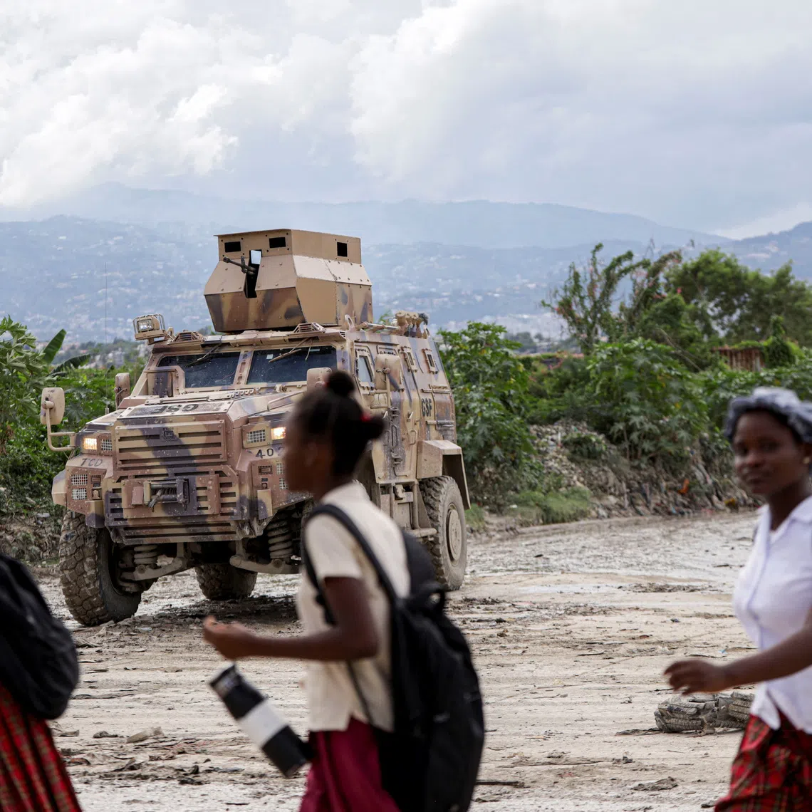 An armored personnel carrier of Haiti's UN-backed Gang Suppression Force (GSF) patrols an area after El Salvador announced a rescue mission for four air force members in the GSF that went missing after a gang ambush, in Port-au-Prince, Haiti, October 23, 2026. REUTERS/Patrice Noel