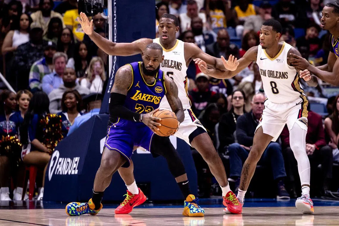 Los Angeles Lakers forward LeBron James dribbles against New Orleans Pelicans centre Trey Jemison III during the second half at Smoothie King Centre.