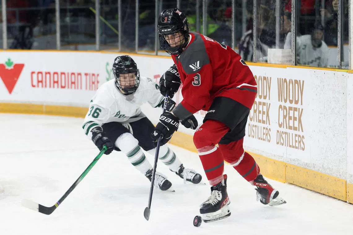 Ottawa's Zoe Boyd and Boston's Loren Gabel of the Professional Women's Hockey League (PWHL) struggle for the puck during first period action in Ottawa, Ontario, Canada January 24, 2024. REUTERS/Patrick Doyle/File Photo