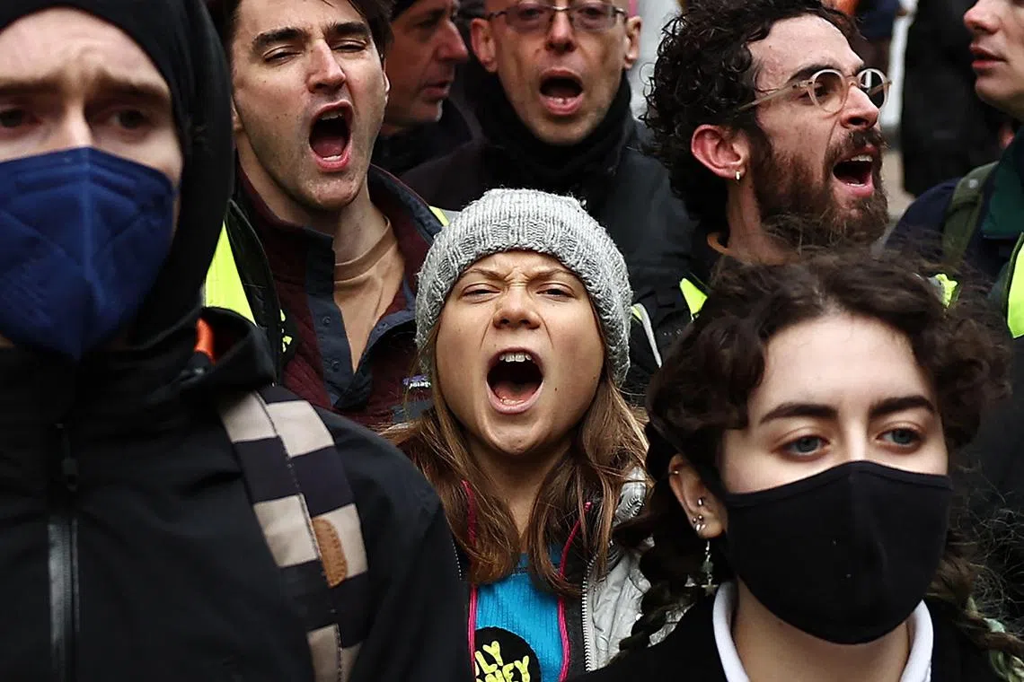 Swedish climate activist Greta Thunberg shouting slogans as she joins protesters outside the InterContinental London Park Lane during the "Oily Money Out" demonstration organised by Fossil Free London and Greenpeace on the sidelines of the opening day of the Energy Intelligence Forum 2023 in London on Oct 17.