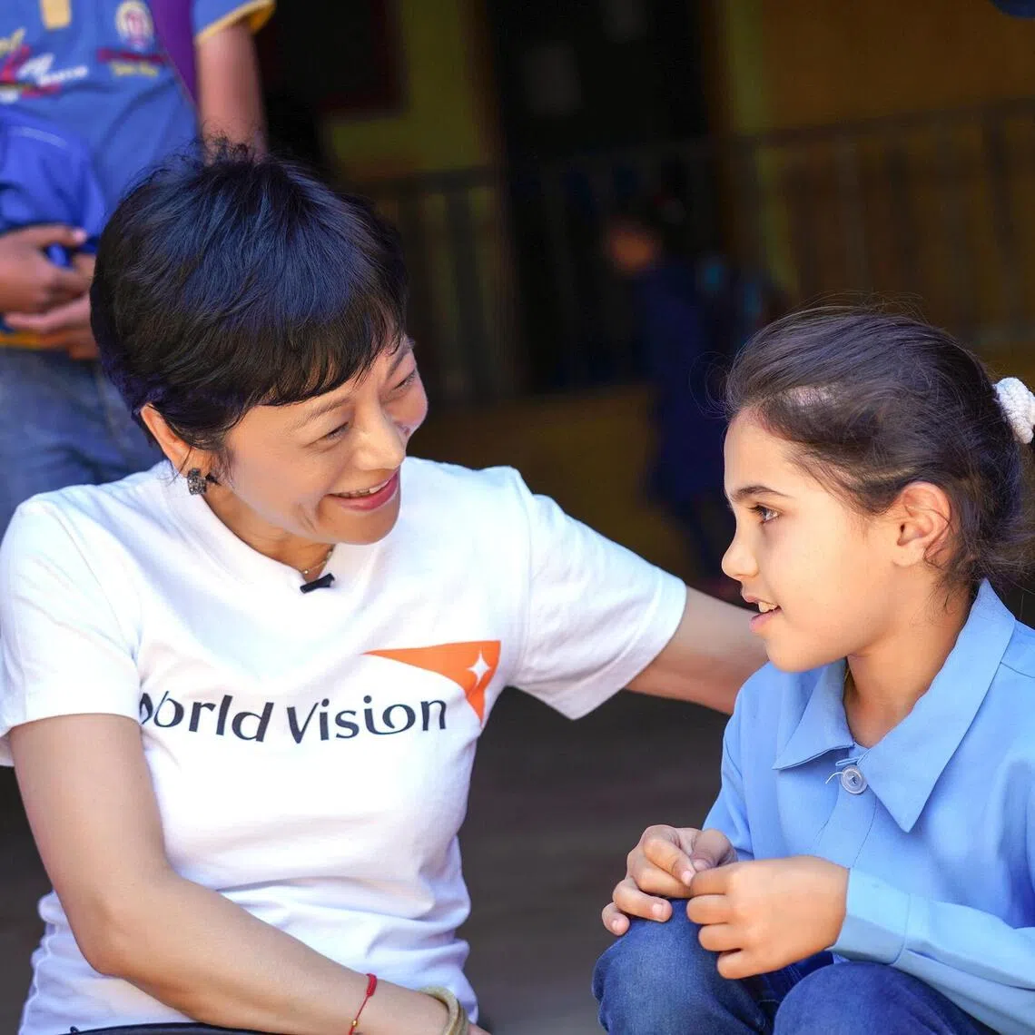 Sylvia Chang with a child during a field trip to Lebanon in 2019.