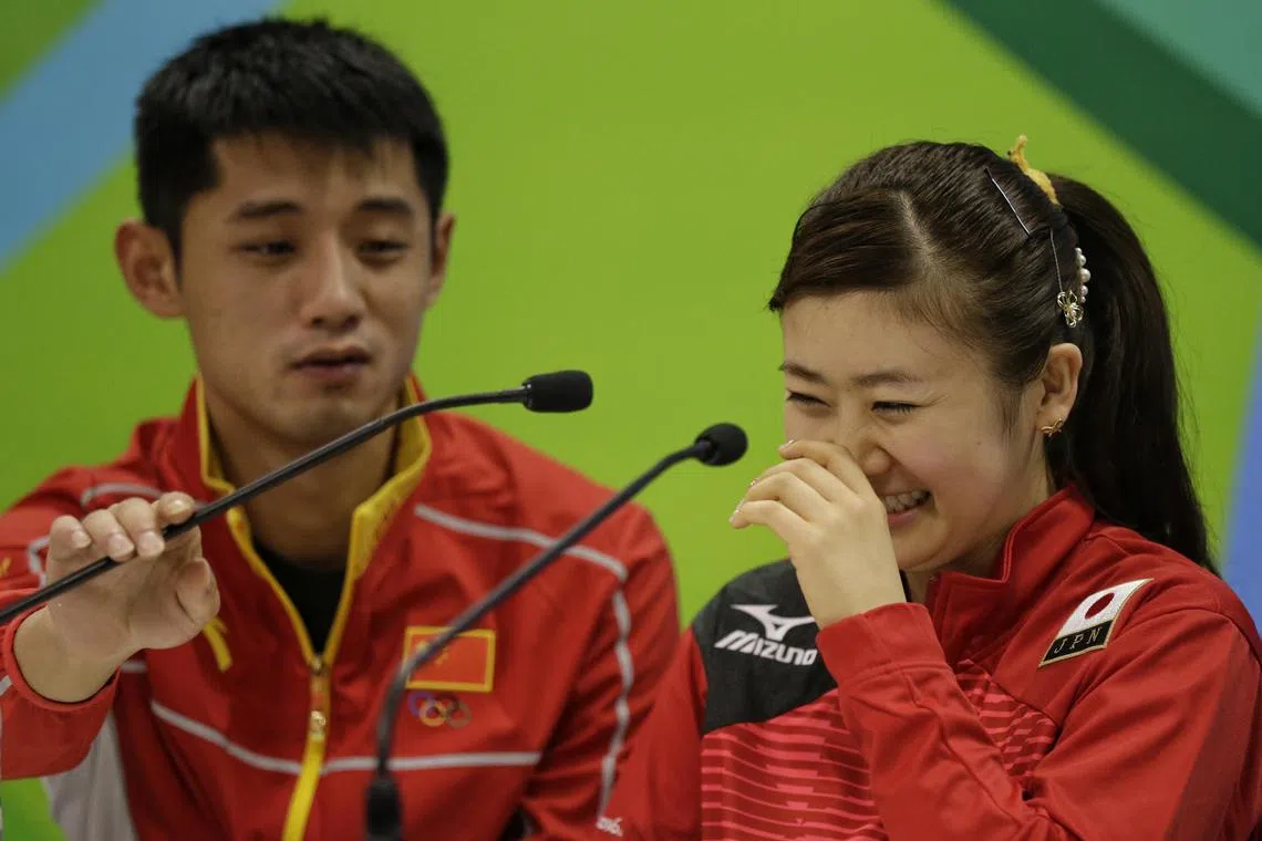 Ai Fukuhara of Japan sharing a light-hearted moment with Zhang Jike of China during a press conference for the table tennis competition of Rio 2016 Olympics Games on Aug 3, 2016.