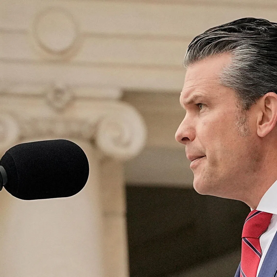 FILE PHOTO: U.S. Defense Secretary Pete Hegseth delivers remarks at the annual National Memorial Day Observance in the Memorial Amphitheater at Arlington National Cemetery in Arlington, Virginia, U.S., May 26, 2025. REUTERS/Ken Cedeno/File Photo