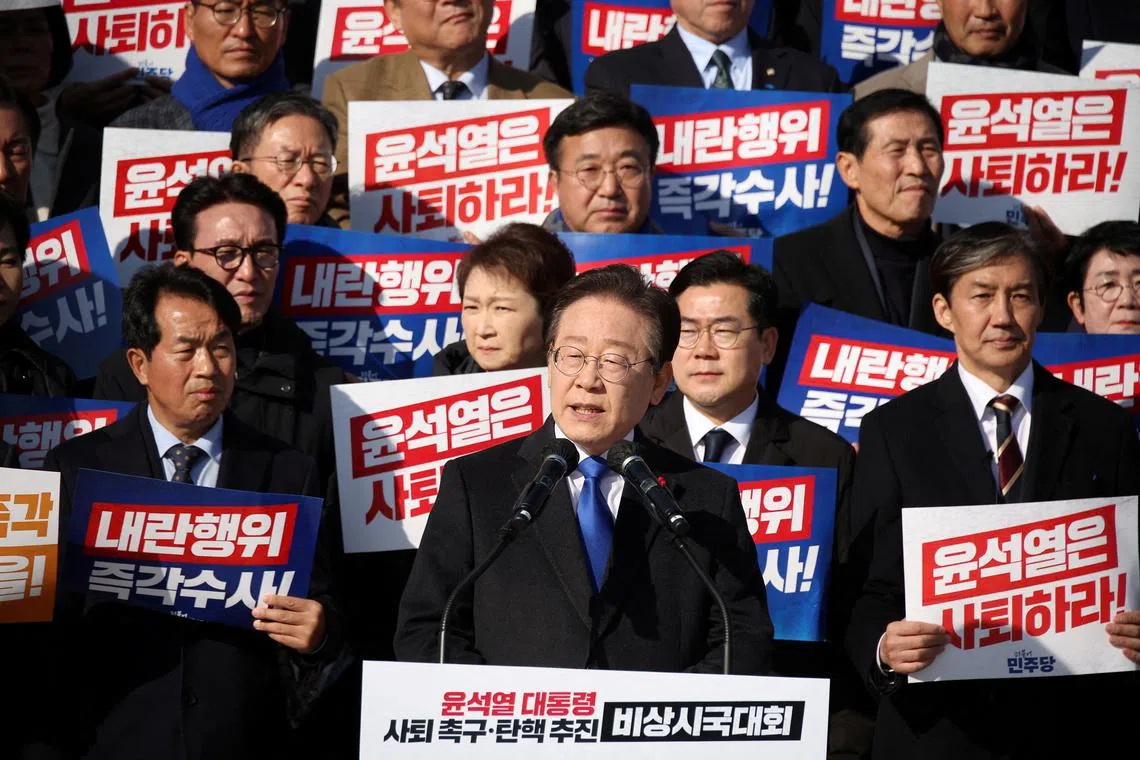 FILE PHOTO: South Korea's main opposition Democratic Party leader Lee Jae-myung, lawmakers and people attend a rally to condemn South Korean President's surprise declarations of the martial law last night and to call for his resignation, at the national assembly in Seoul, South Korea December 4, 2024. REUTERS/Kim Hong-Ji/File Photo
