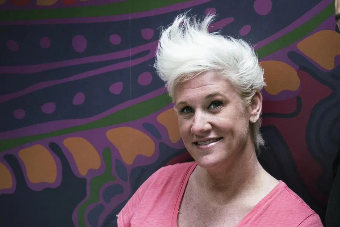 Anne Burrell at her restaurant, Phil & Anne's Good Time Lounge, in New York on Aug 25, 2016. Burrell, a chef and television personality known for her kinetic swoop of blond hair and an energy to match, died on June 17, 2025, in Brooklyn. She was 55. 