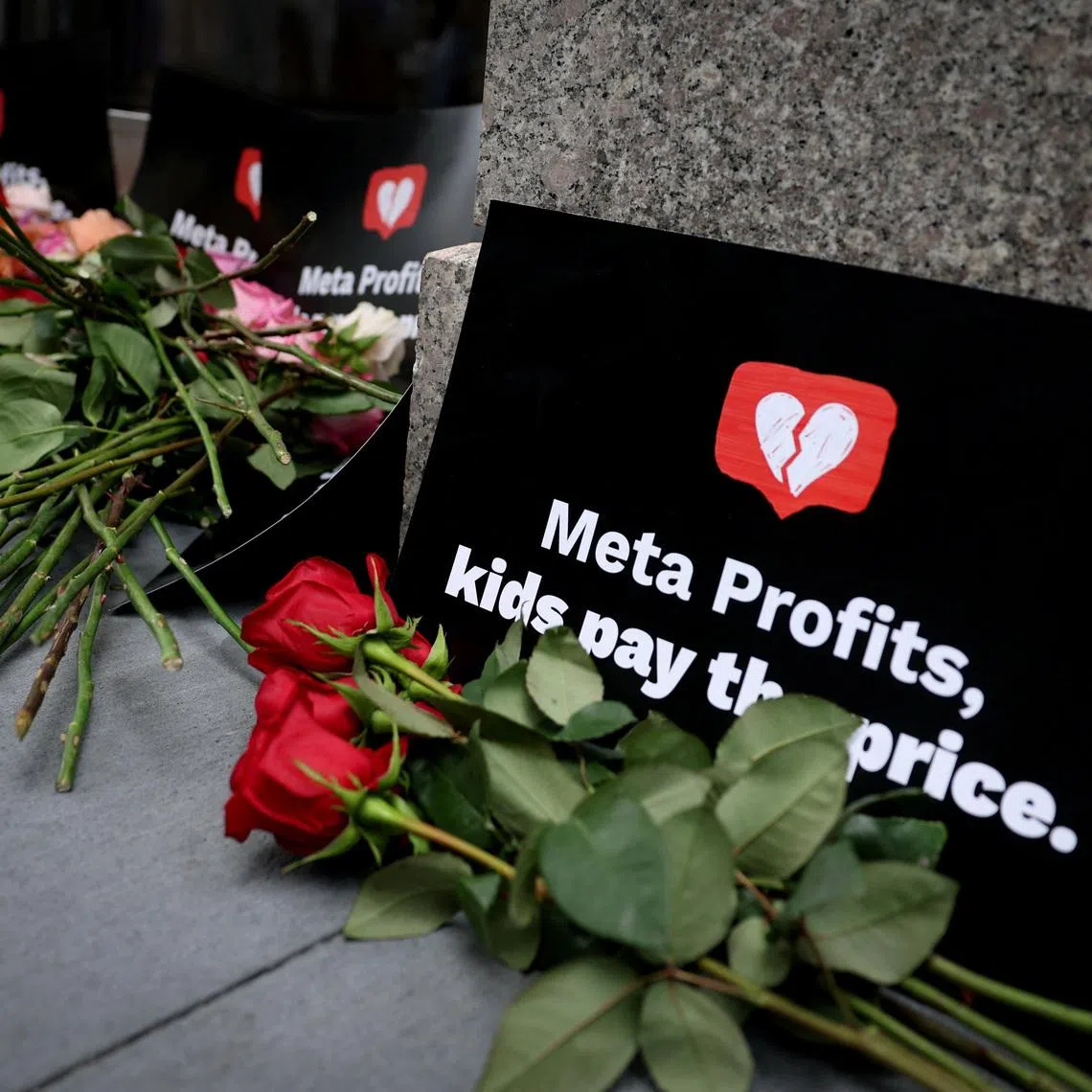 Flowers for victims of social media harms are seen left outside the New York City headquarters of Meta, in New York City, New York , U.S., September 17, 2025. REUTERS/Mike Segar