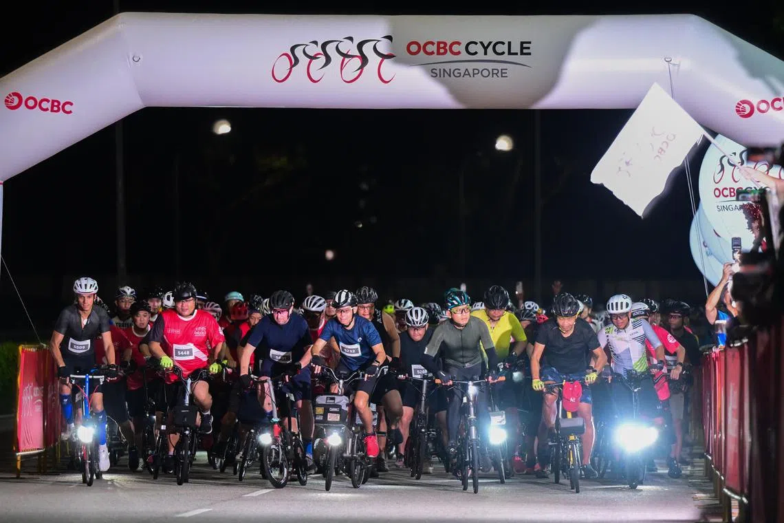 Participants in the new foldie bike category of the OCBC Cycle being flagged off at the Singapore Sports Hub on May 12.