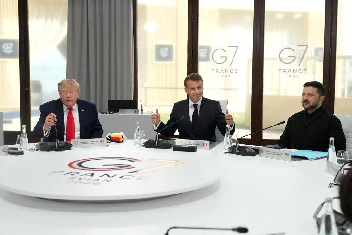 U.S. President Donald Trump, French President Emmanuel Macron and Ukrainian President Volodymyr Zelenskiy during a working session at the G7 summit in Evian-les-Bains, France, June 16, 2026.     Thibault Camus/Pool via REUTERS