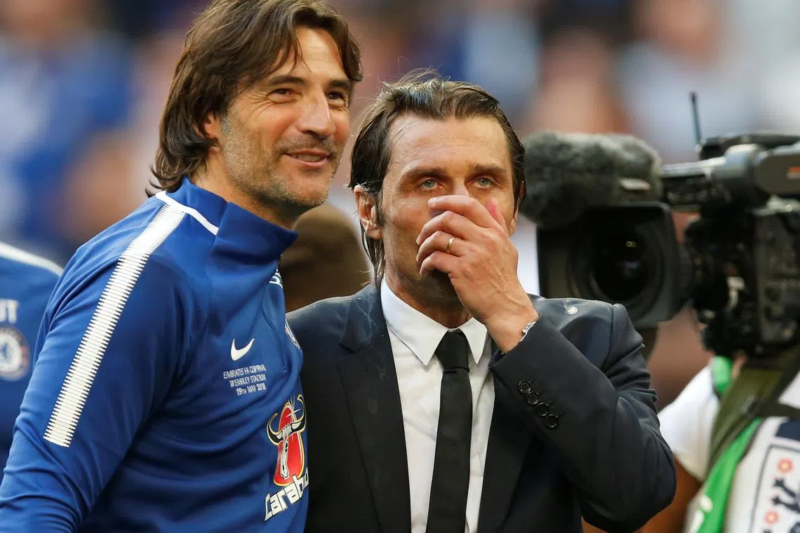 FILE PHOTO: Soccer Football - FA Cup Final - Chelsea vs Manchester United - Wembley Stadium, London, Britain - May 19, 2018   Chelsea coach Paolo Vanoli and manager Antonio Conte celebrate after winning the FA Cup final   REUTERS/Andrew Yates/File Photo