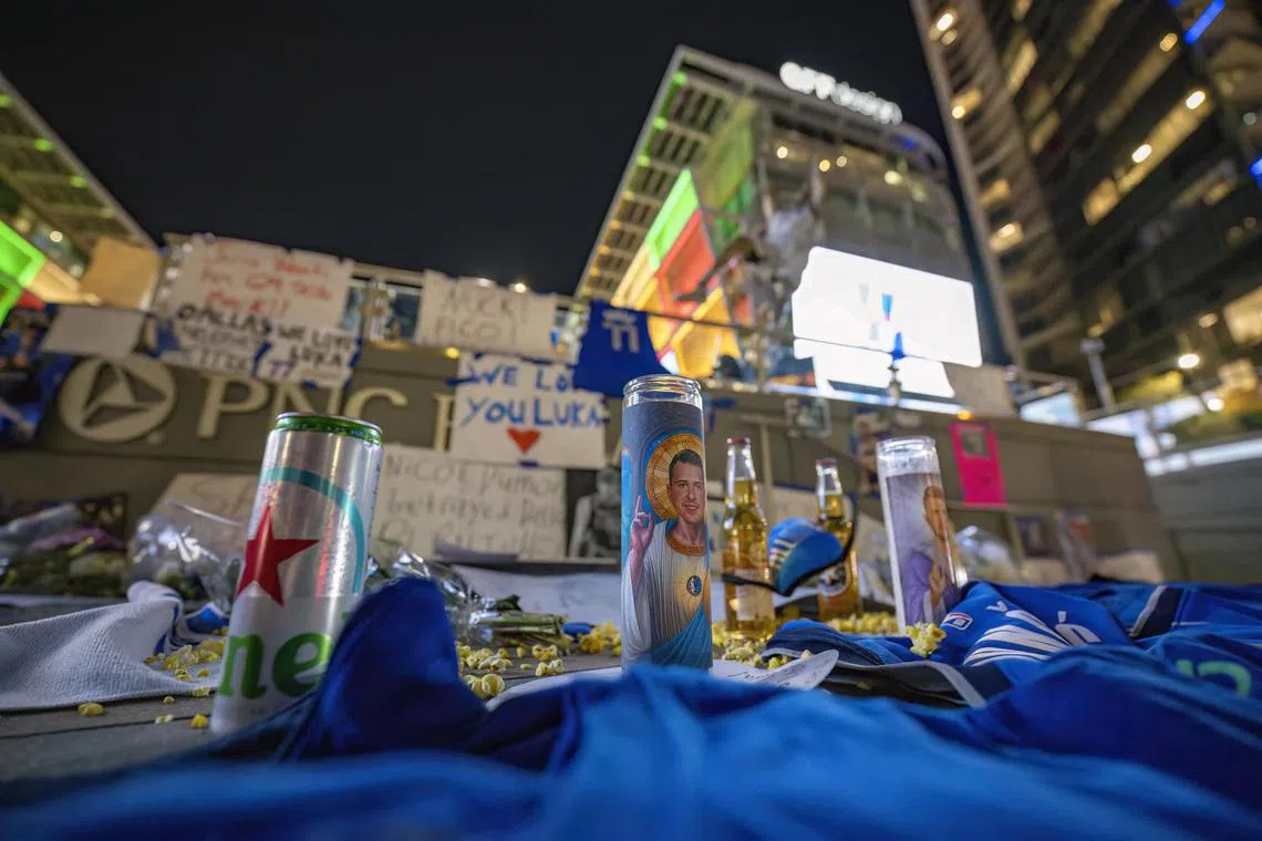 Dallas Mavericks fans leave notes and memorabilia after the game between the Dallas Stars and the Columbus Blue Jackets to protest the trade of Mavericks point guard Luka Doncic to the Los Angeles Lakers. 