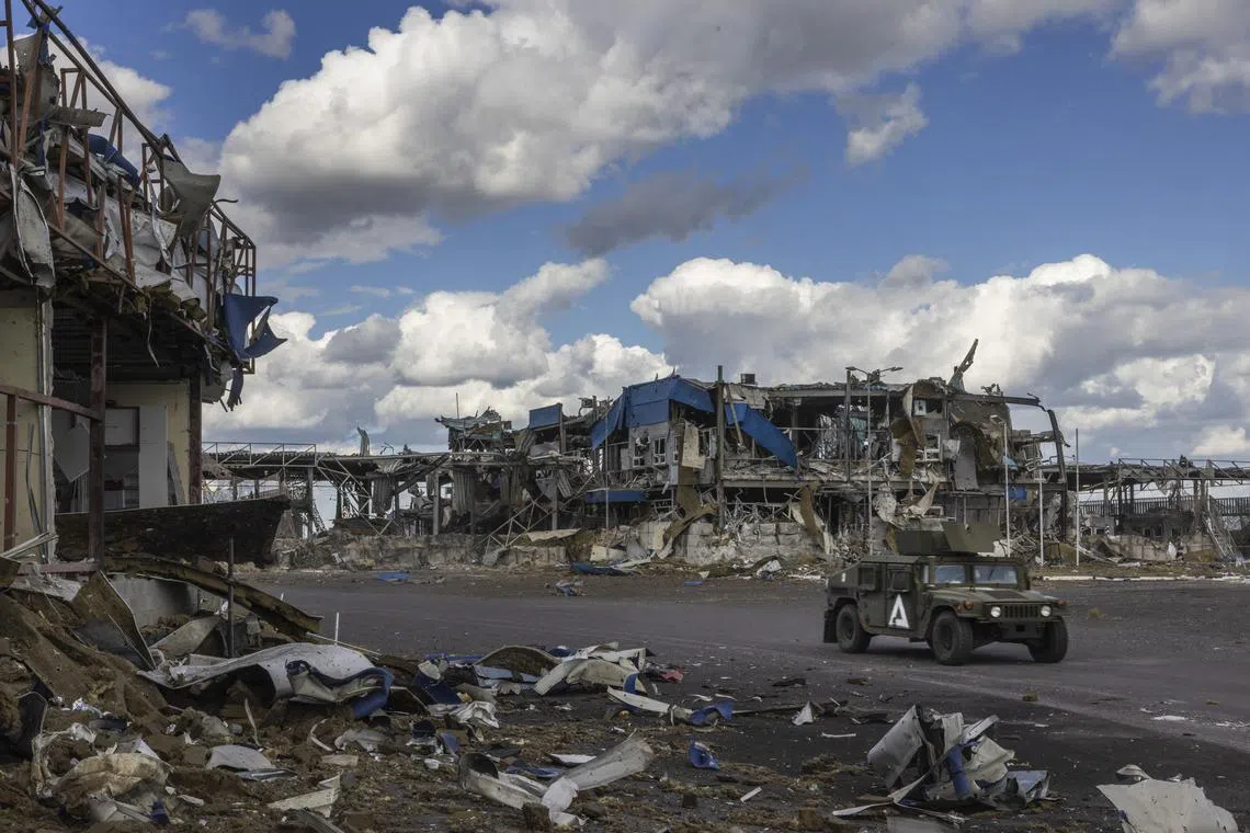 A Ukrainian army vehicle passes through the destroyed Russian border post at the Sudzha crossing with Ukraine, in the Kursk region of Russia, in August 2024.