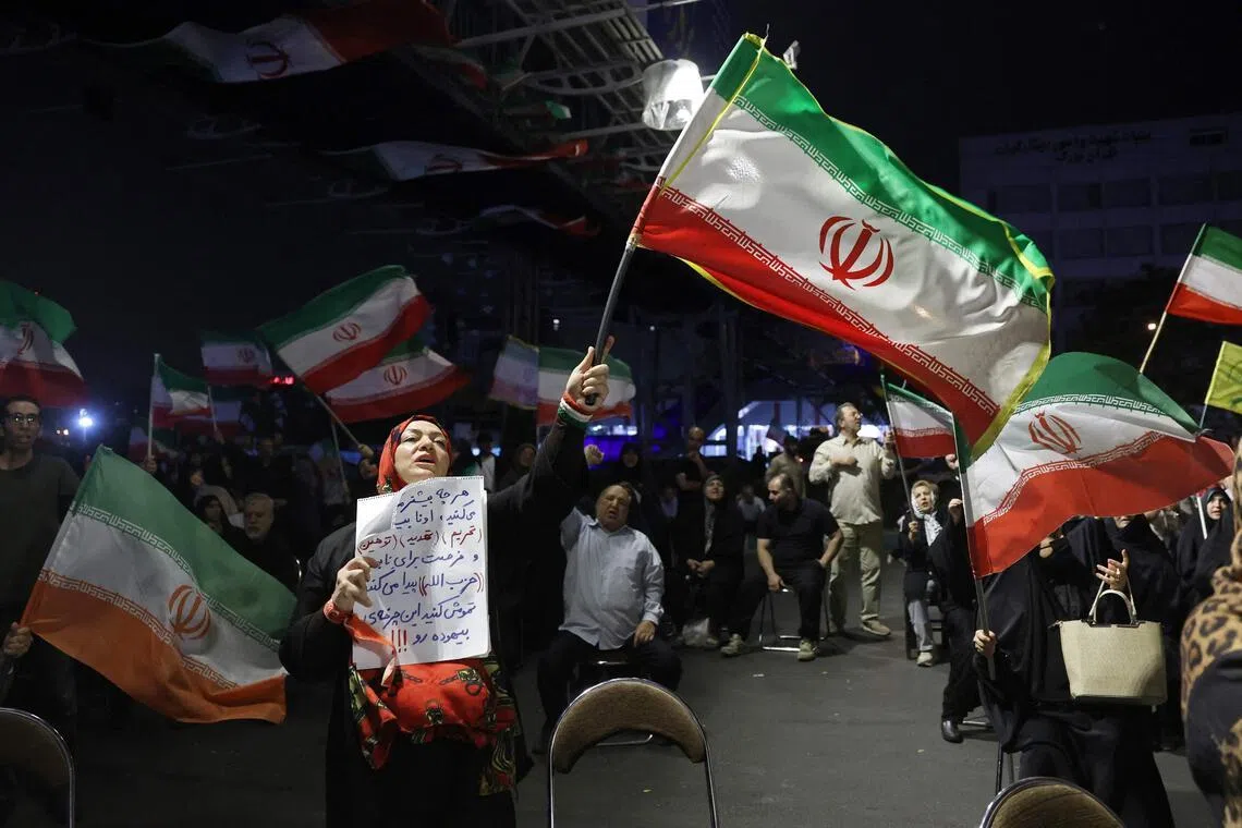 Protesters wave Iran’s flag during an anti-US and anti-Israel protest in Tehran on May 29, 2026.
