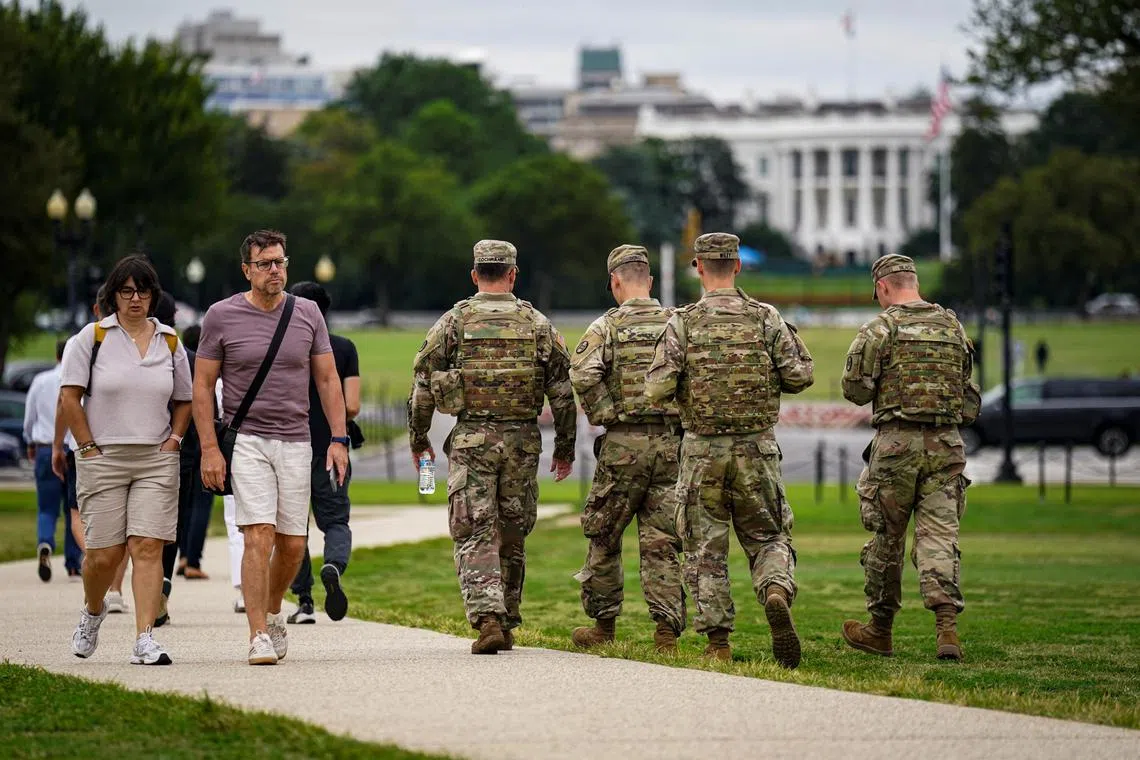 US National Guard soldiers walking along Washington's National Mall on Aug 21.
