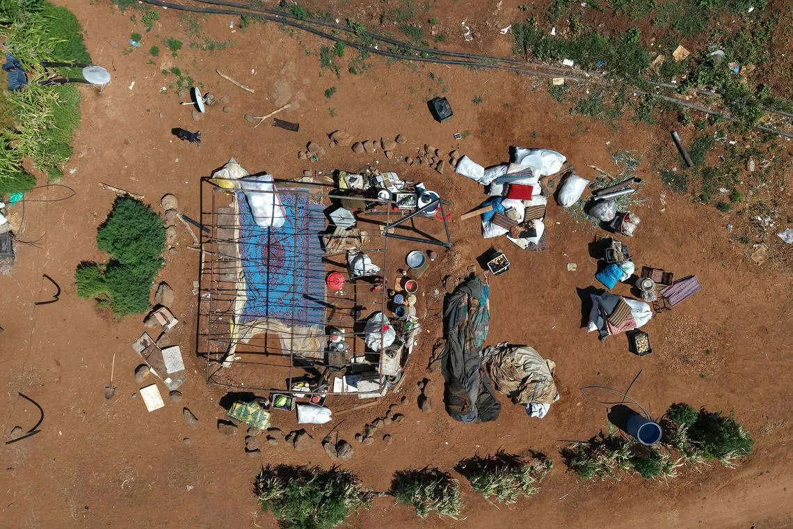 Bedouin residents dismantling their camp in the vicinity of the Druze al-Mazraa village in Syria's southern Sweida gvernorate, on July 17, 2025, as they prepare to leave for safer areas amid ongoing clashes. 