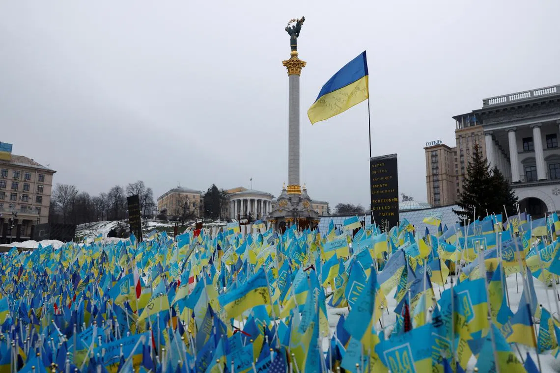 Flags representing fallen soldiers, including foreign soldiers are seen in the snow, on Independence Square, as Russia's attack on Ukraine continues, in Kyiv, Ukraine, December 22, 2022. 