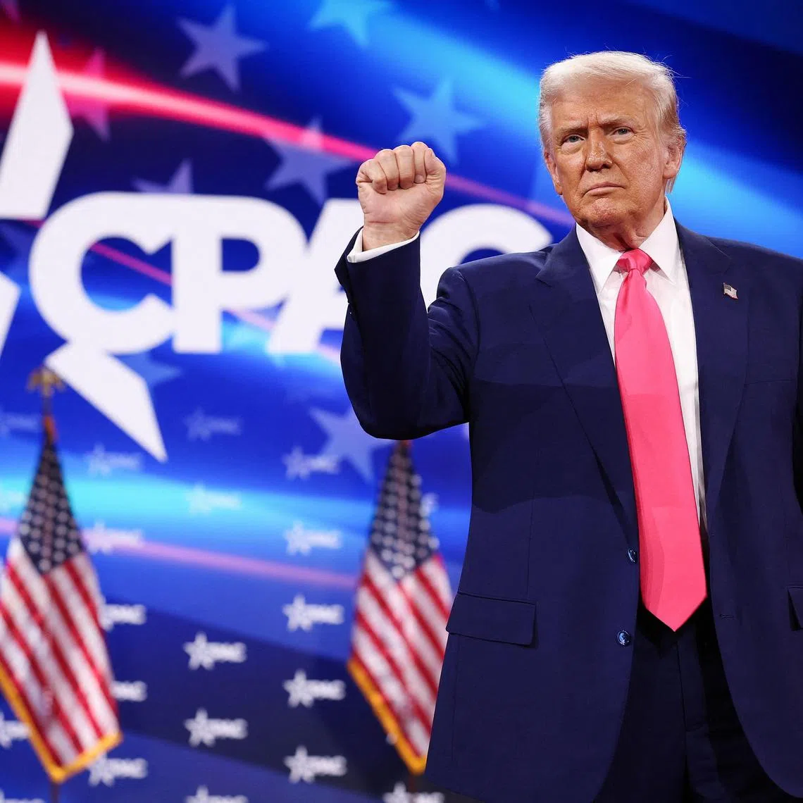 OXON HILL, MARYLAND - FEBRUARY 22: U.S. President Donald Trump reacts to the crowd while arriving at the Conservative Political Action Conference (CPAC) at the Gaylord National Resort Hotel and Convention Center on February 22, 2025 in Oxon Hill, Maryland. The annual four-day gathering brings together conservative U.S. lawmakers, international leaders, media personalities and businessmen to discuss and champion conservative ideas.   Win McNamee/Getty Images/AFP (Photo by WIN MCNAMEE / GETTY IMAGES NORTH AMERICA / Getty Images via AFP)