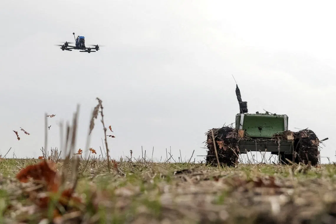 FILE PHOTO: An unmanned ground vehicle with a landmine installed on it and a first person view (FPV) drone operate in Kharkiv region, amid Russia's attack on Ukraine, January 13, 2025. REUTERS/Sofiia Gatilova/File Photo