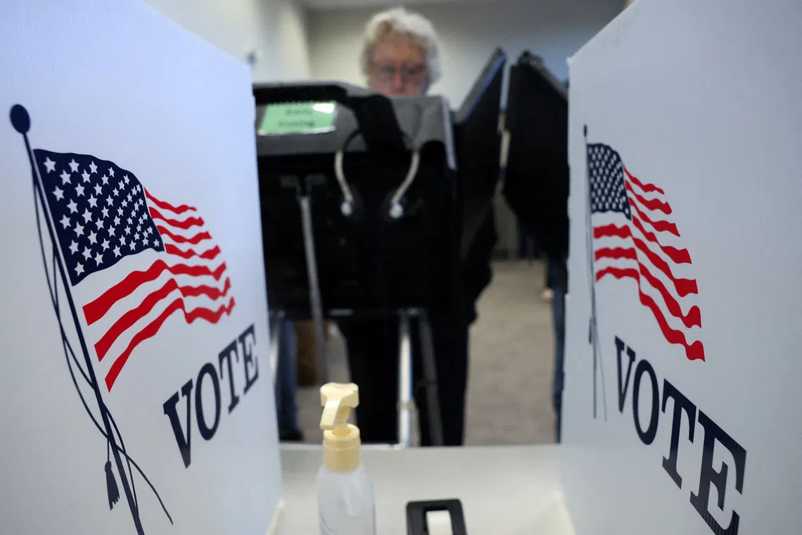 A woman casts her vote outside the Medina County Board of Elections, as early voting begins in Ohio on Oct 6.