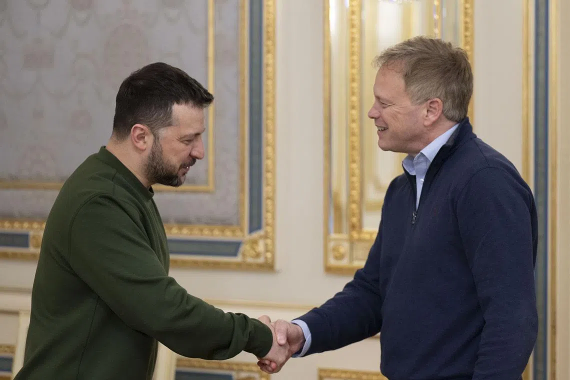 Ukrainian President Volodymyr Zelensky (left) welcomes British Defence Secretary Grant Shapps to Kyiv.