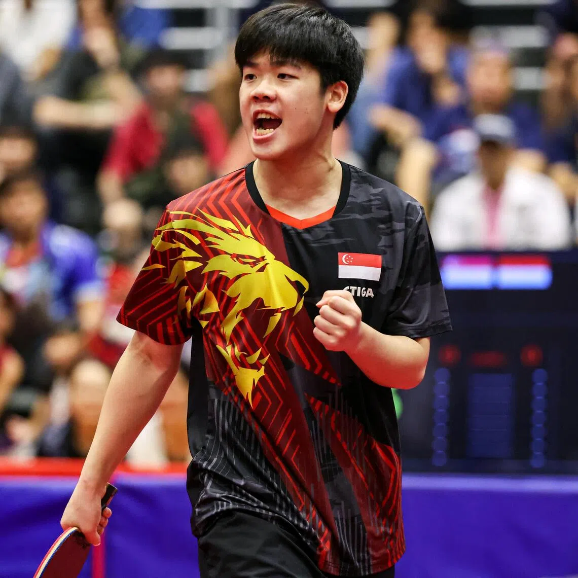 Singapore's Izaac Quek celebrating after scoring a point against Indonesia's Bima Abdi Negara in the men's singles final at the SEA Games on Dec 19.
