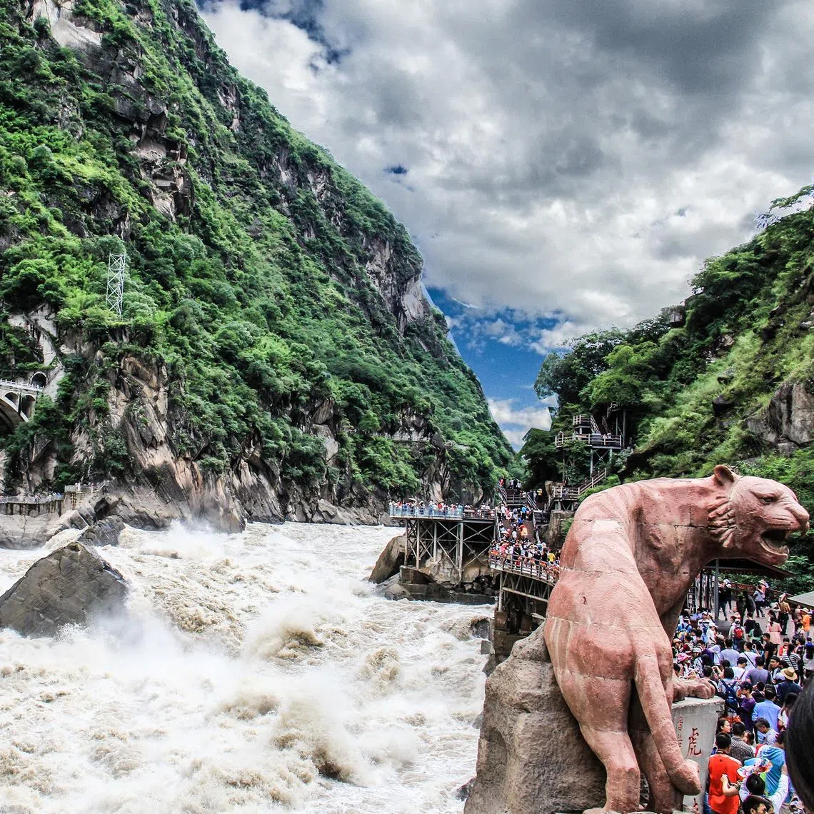Escalators took the writer’s family to the viewing point at Tiger Leaping Gorge, without having to climb several hundred steps.