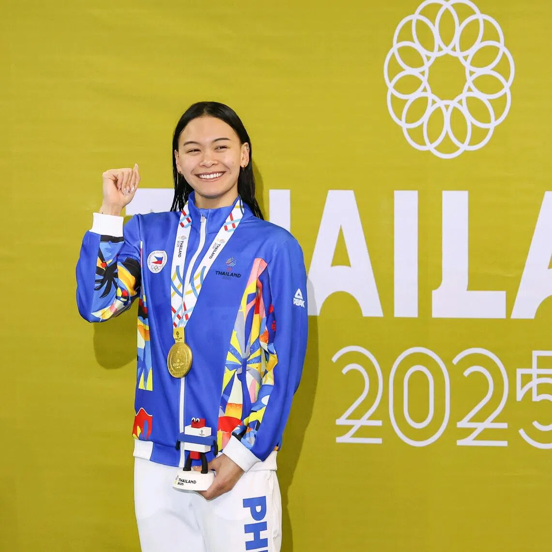 Filipino-Canadian national swimmer Kayla Sanchez celebrating after winning the SEA Games women's 100m freestyle gold on Dec 12.