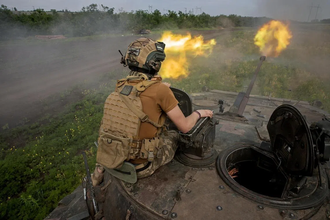 Ukrainian soldiers fire on Russian military positions, south of Bakhmut.