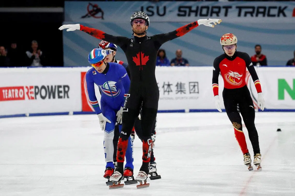FILE PHOTO: Speed Skating - ISU Short Track World Tour - Milano Ice Skating Arena, Milan, Italy - February 16, 2025 Canada's William Dandjinou celebrates after winning the men's 1000m Final A REUTERS/Alessandro Garofalo/File Photo