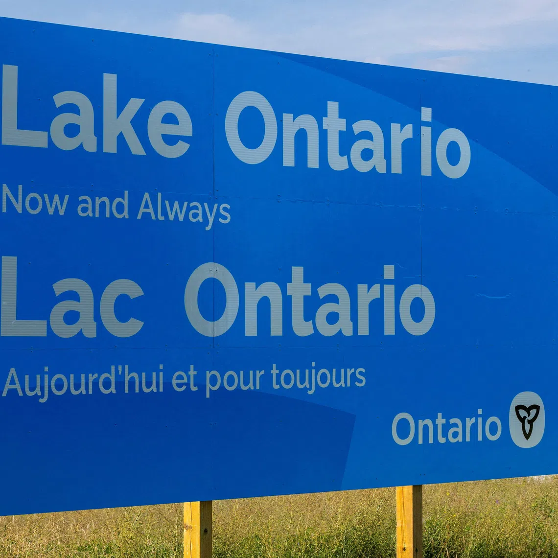 FILE PHOTO: A sign reading \"Lake Ontario, Now and Always,\" unveiled by Ontario Premier Doug Ford at Fifty Point Conservation Area, after U.S. President Donald Trump signed an executive order renaming Lake Ontario as \"Lake America,\" near Grimsby, Ontario, Canada, August 29, 2026. REUTERS/Carlos Osorio/File Photo