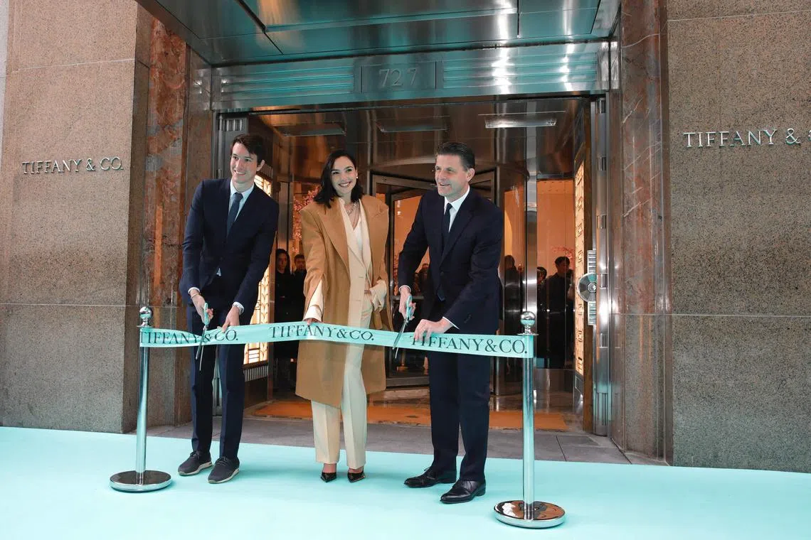 (L-R) Rimowa CEO Alexandre Arnault, actress Gal Gadot, and Tiffany CEO Anthony Ledru, attend the Tiffany & Co ribbon-cutting ceremony for Tiffany's flagship store in New York, April 26, 2023. (Photo by Kena Betancur / AFP)