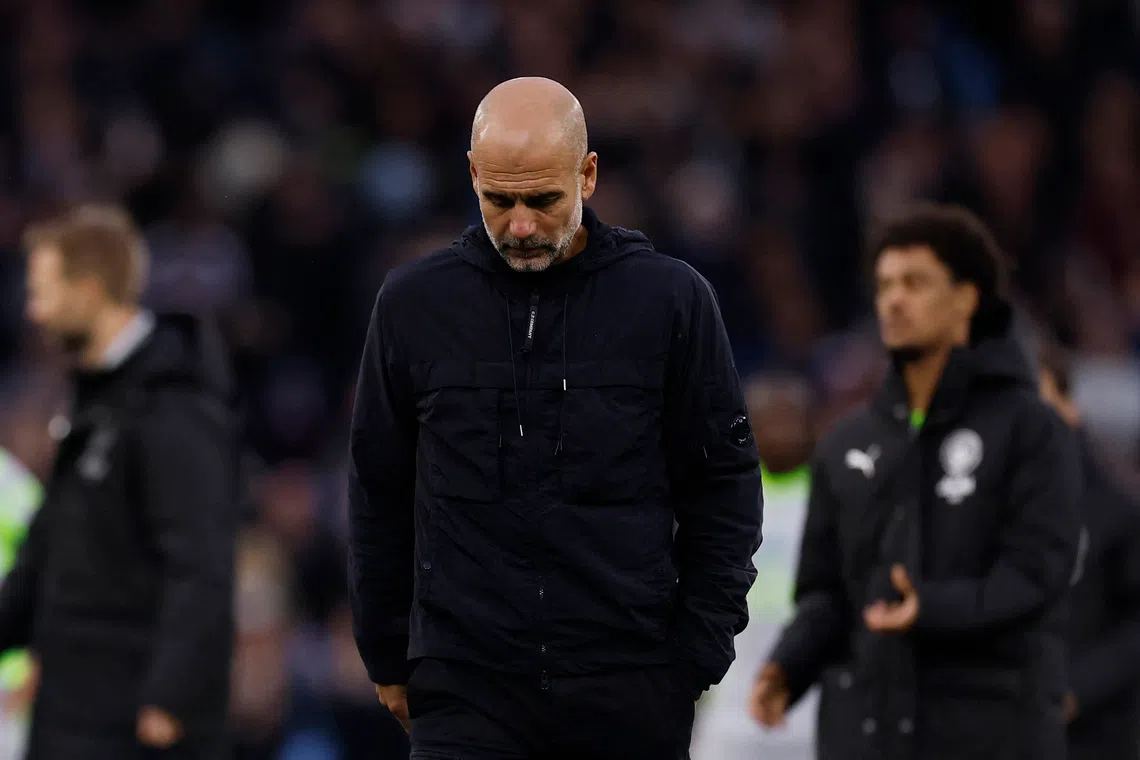 Soccer Football - Premier League - Aston Villa v Manchester City - Villa Park, Birmingham, Britain - October 26, 2025 Manchester City manager Pep Guardiola looks dejected after the match Action Images via Reuters/Andrew Couldridge