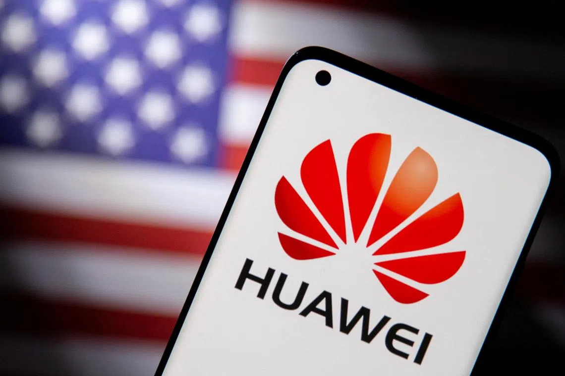 FILE PHOTO: Smartphone with a Huawei logo is seen in front of a U.S. flag in this illustration taken September 28, 2021. REUTERS/Dado Ruvic/Illustration/File Photo