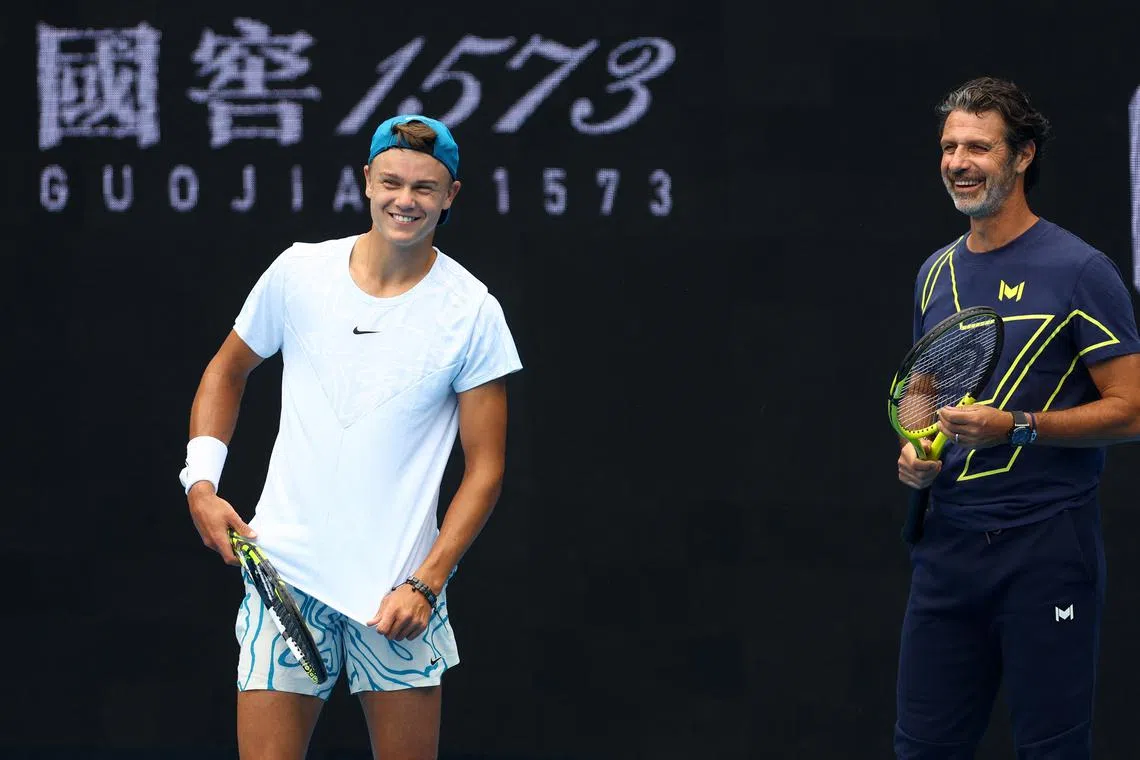 Tennis - Australian Open - Melbourne Park, Melbourne, Australia - January 15, 2023 Denmark's Holger Rune and then coach Patrick Mouratoglou during a practice session REUTERS/Hannah Mckay/File Photo